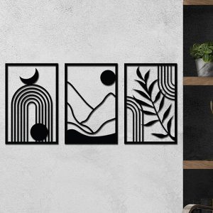 The 3-piece wooden wall art set hanging on a textured white wall in a living room