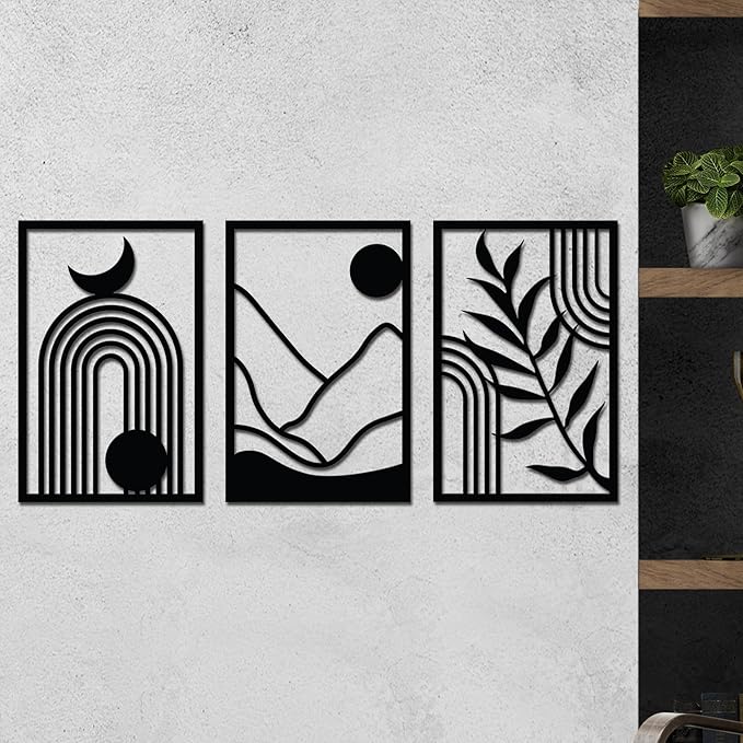 The 3-piece wooden wall art set hanging on a textured white wall in a living room