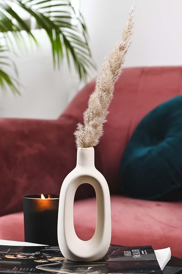 White ceramic donut-shaped flower vase for home and office decoration