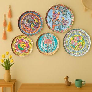 A close-up of a single Madhubani art plate, part of a 5-piece set of Indian wall decor