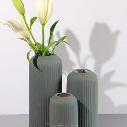 The Craftribal's modern ceramic vase set displayed on a shelf in a stylish living room